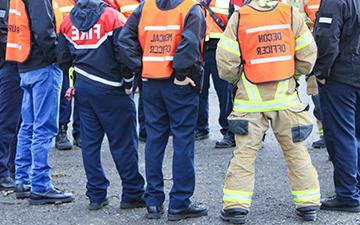 Viasat enterprise internet connects a disaster response team gathered around talking